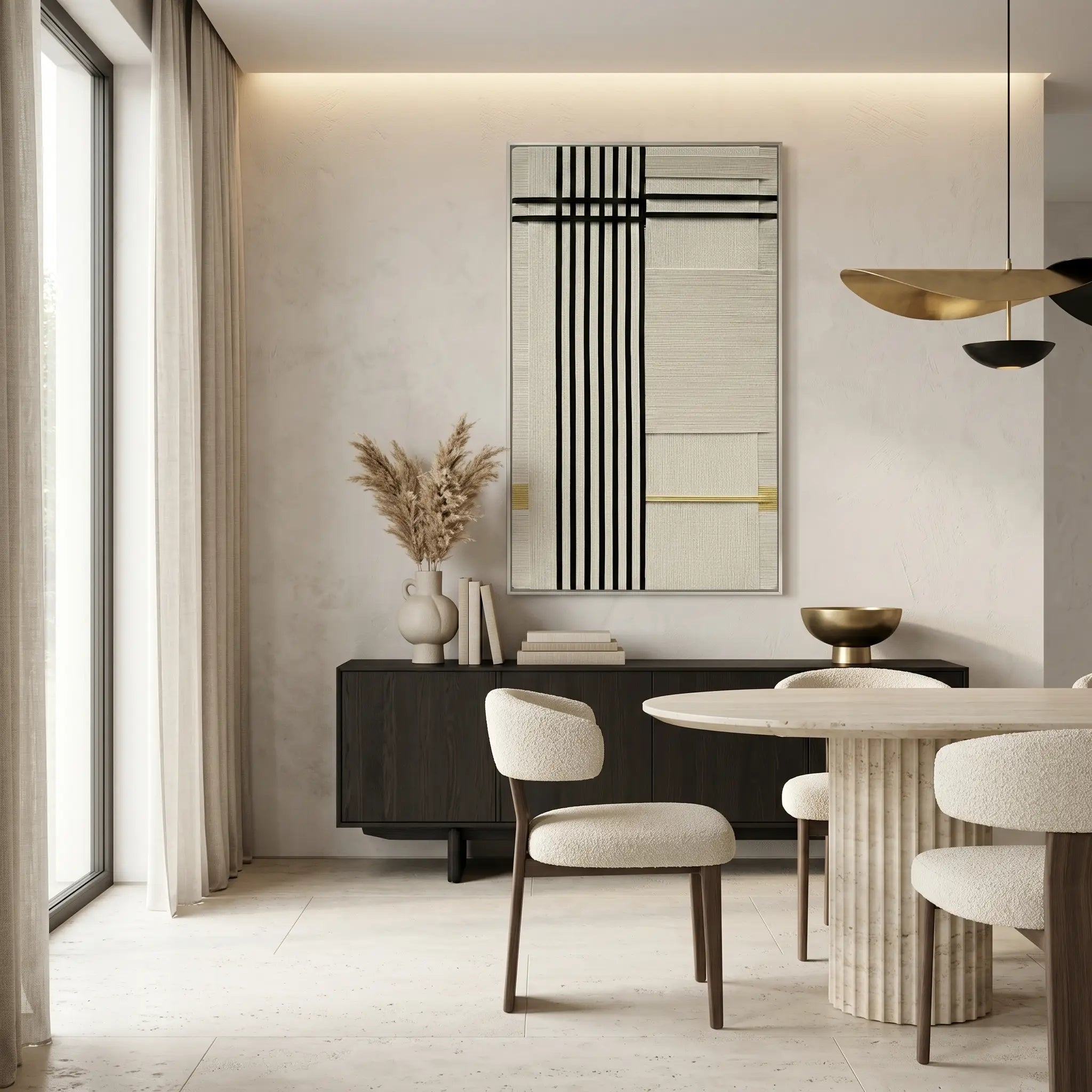 Framed fiber art tapestry with a minimalist geometric design displayed in a high-end dining space featuring cream furniture and gold lighting.