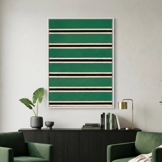 Large vertical hand-woven wool wall art featuring horizontal stripes in forest green, black, and cream, hanging above a black sideboard flanked by two green armchairs.