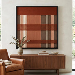 Earth-toned Tuscan Plaid framed wall art styled elegantly above a wooden sideboard adorned with a ceramic vase in a serene living room setting.