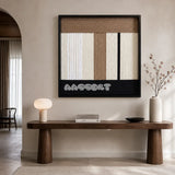 Undisturbed Snow cream taupe and black textile wall art displayed above a sculptural walnut console in a calm modern entryway.