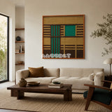 Vast Horizon geometric yarn wall art displayed above a cream sofa in a warm modern living room.