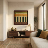 Textured soft cotton cord wall hanging in a dark wood frame styled above a contemporary low-profile cabinet, blending organic materials with minimalist home decor.