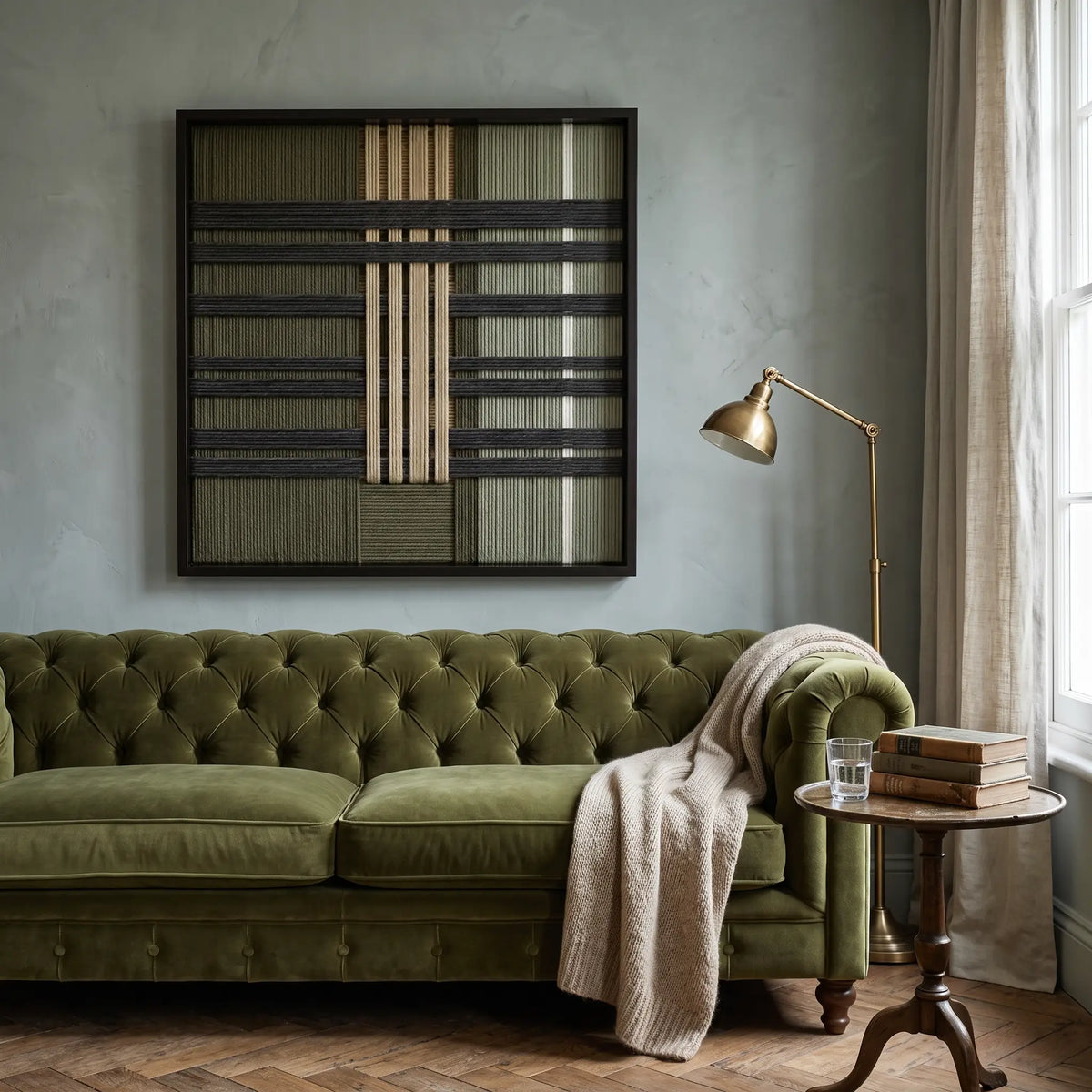 The Verdant Silence hand-woven tapestry creates a calm focal point above an olive green tufted sofa in a stylish living room.