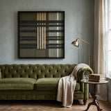 The Verdant Silence hand-woven tapestry creates a calm focal point above an olive green tufted sofa in a stylish living room.