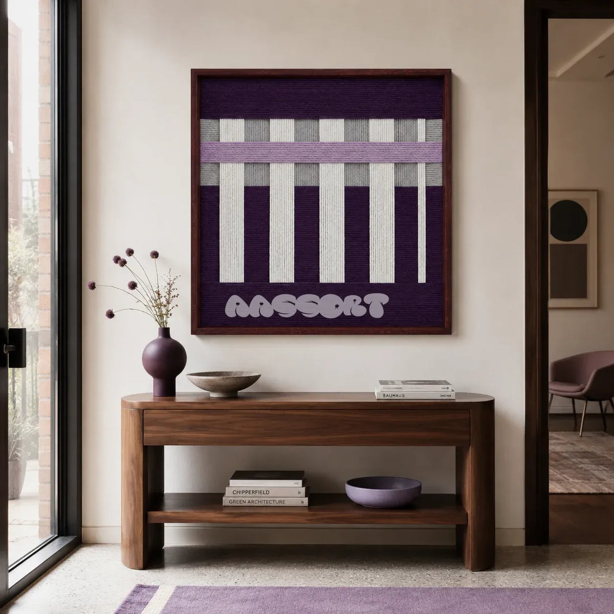 Violet Aftershock purple lavender and white textile wall art displayed above a walnut console in a softly lit modern entryway.