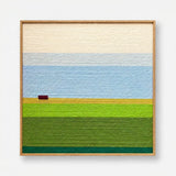 Full product view of the landscape soft cotton cord wall art framed neatly, showcasing cream sky and green fields.
