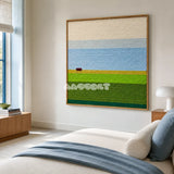 Whispering Fields blue and green yarn landscape wall art displayed above a bed in a serene sunlit bedroom.