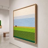 Side profile view of the framed Whispering Fields soft cotton cord wall art mounted on a gallery wall, showing its depth and clean profile.