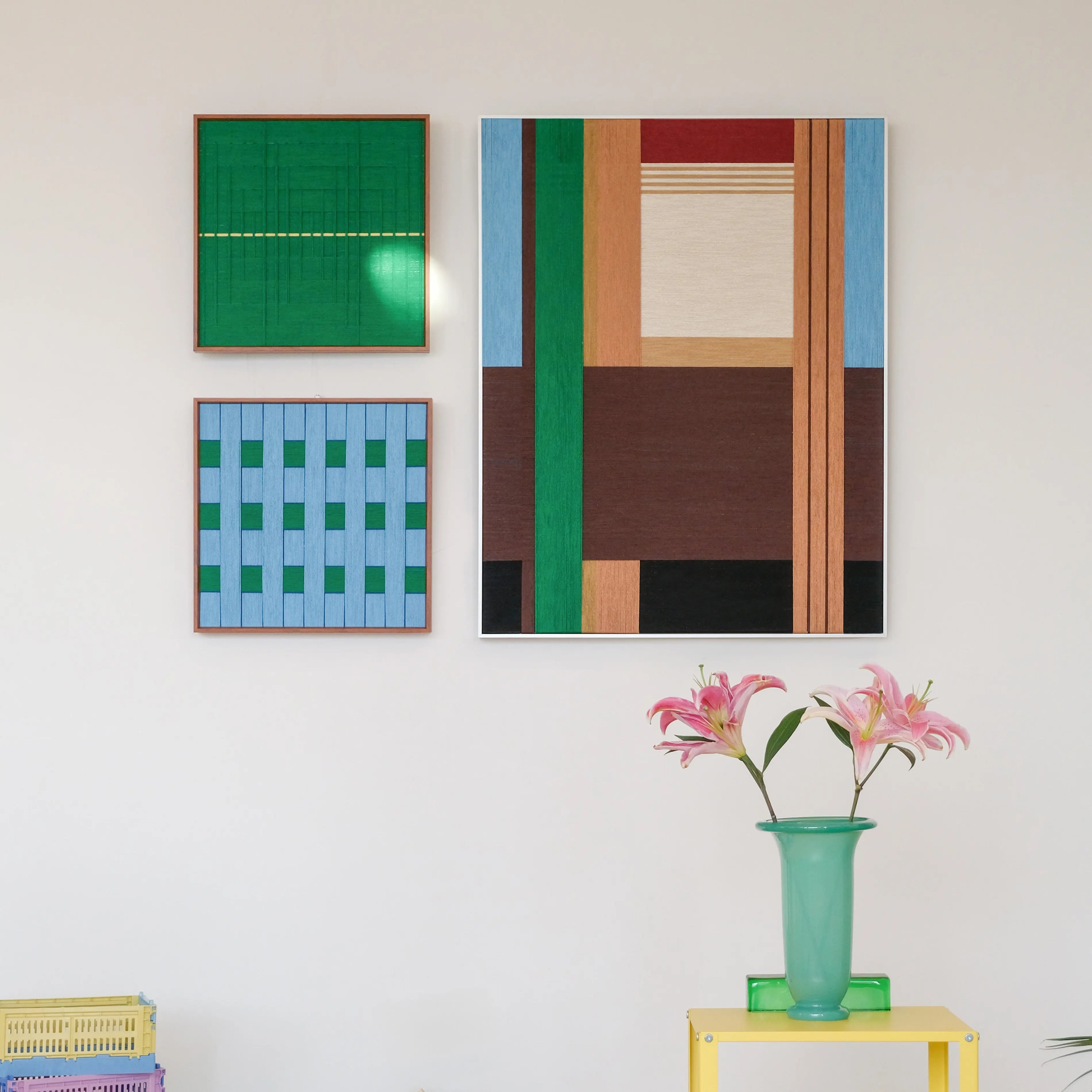 Two-piece Wild yarn woven wall art set featuring coordinated earth-stripe panels—chocolate, tan, green—mounted on wood frames for a cohesive decorative display
