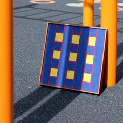 Window Peek at Moon yarn woven art placed on a street bollard in daylight, featuring crisp stair-step gradient from azure to sky blue
