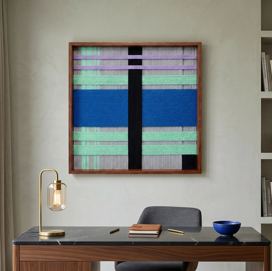 Winter Aurora textured fiber wall art styled in a contemporary home office, hanging above a sleek desk with a brass lamp.